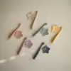 Mushie Escova de Dentes de Aprendizagem Star Shifting Sand com base de silicone