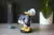 Cable Guys Donald Duck Suporte para Comandos e Smartphones Compatível com PlayStation 5 DualSense, Xbox Series S/X e iPhones